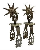 Pair of South American gaucho steel and brass spurs with eight-spike heel rowels