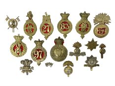 Fifteen cap badges of Irish interest including 4th Royal Irish Dragoon Guards