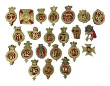 Twenty-two regimental cap badges