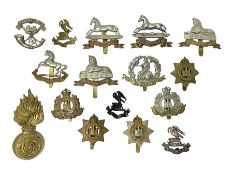 Sixteen cap badges including two Liverpool Pals (one hallmarked silver)