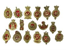 Seventeen regimental cap badges