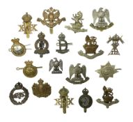 Eighteen cap badges for Dragoon Guards