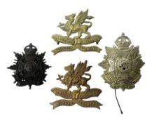 Four Border Regiment cap badges including eleventh battalion (4)
