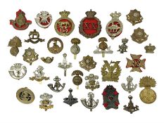Over thirty regimental cap badges for fusiliers