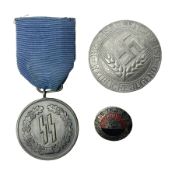 WWII German 'SS' four years Long Service Medal with ribbon; HJ 1st type cap insignia marked RZM M1/1