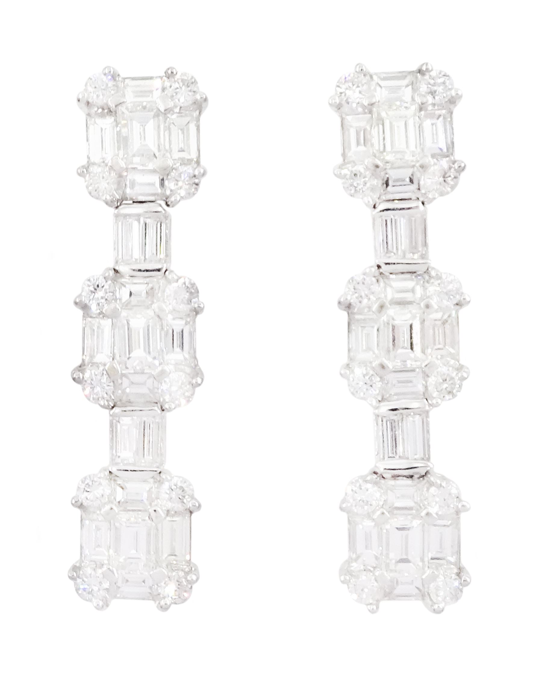 Pair of 18ct white gold baguette cut and round brilliant cut diamond stud earrings