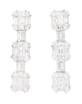 Pair of 18ct white gold baguette cut and round brilliant cut diamond stud earrings