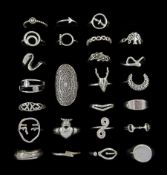 Twenty-five silver rings including skull