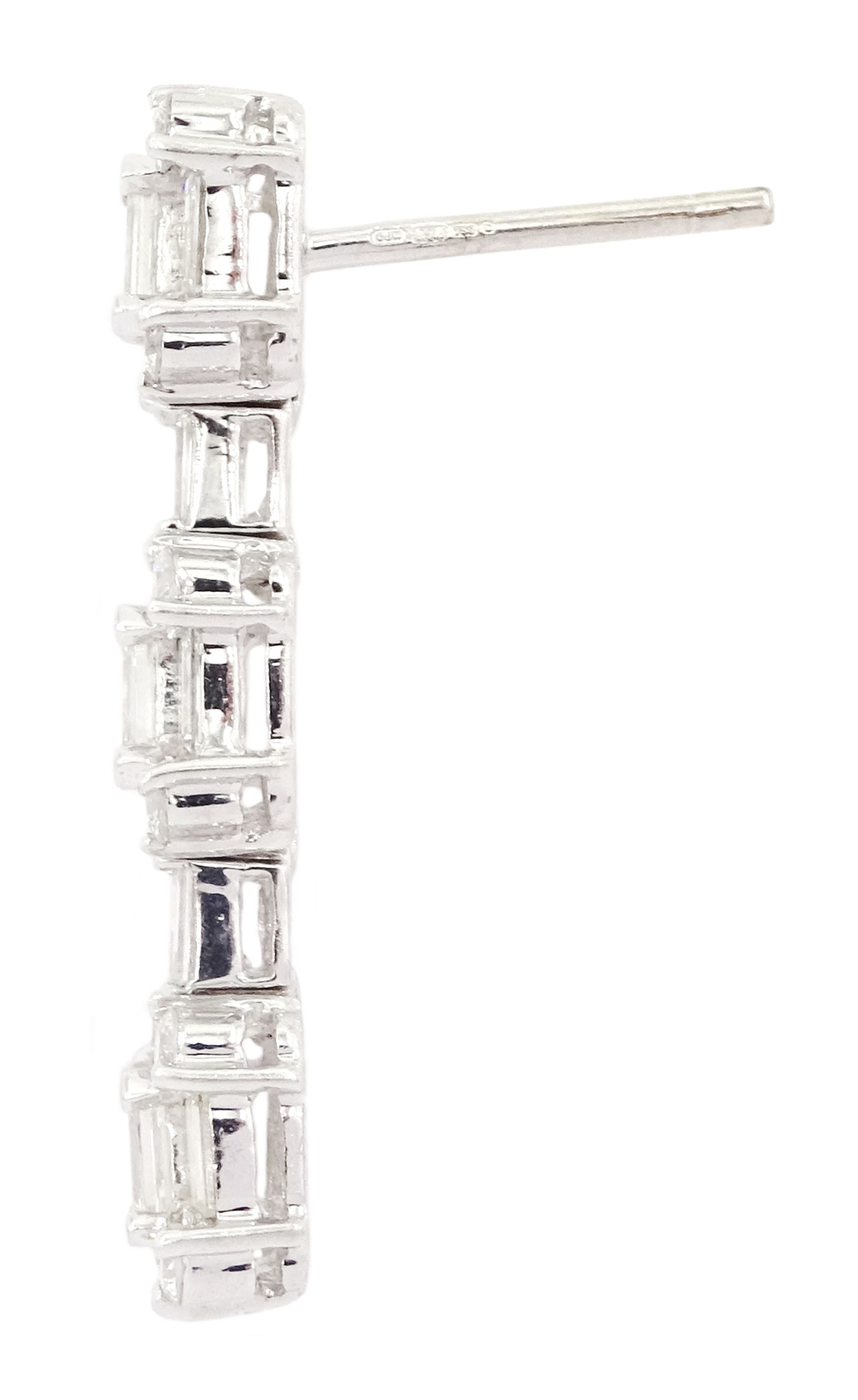 Pair of 18ct white gold baguette cut and round brilliant cut diamond stud earrings - Image 2 of 2