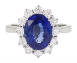 18ct white gold oval cut sapphire and round brilliant cut diamond cluster ring