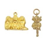 Two 9ct gold pendant / charms including the three wise monkeys and Lincoln Imp