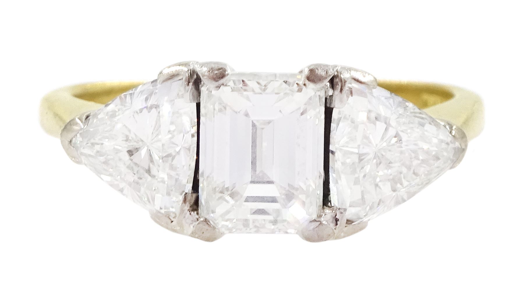 18ct gold three stone emerald cut and trillion cut diamond ring