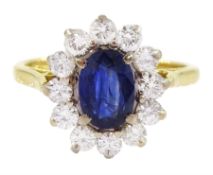 18ct gold oval sapphire and round brilliant cut diamond cluster ring