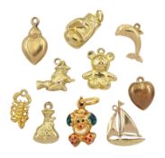 Ten 9ct gold pendant /charms including sailing boat