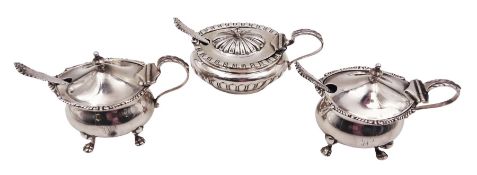 Three silver mustard pots with covers