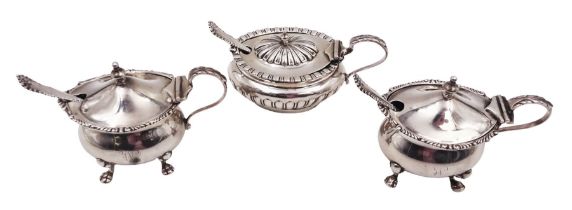 Three silver mustard pots with covers