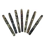 Seven marbleised fountain pens