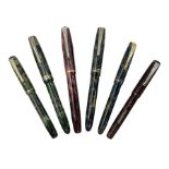 Six Burnham marbleised fountain pens