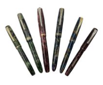 Six Burnham marbleised fountain pens