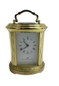 English - 20th century 8-day oval carriage clock