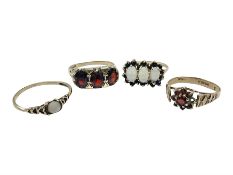 Four 9ct gold stone set rings
