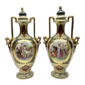 Pair of Vienna style twin handled urns and covers