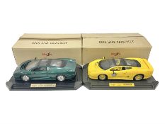 Two Maisto 1:12 scale cars comprising 1992 Jaguar XJ220 Racing car in yellow and 1992 Jaguar XJ220 i