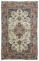 Persian ivory and peach ground rug