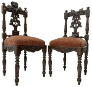 Pair of 19th century heavily carved oak side chairs