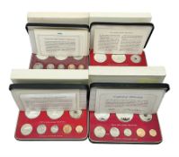 Four Papua New Guinea proof eight coin sets