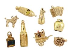 Eight 9ct gold pendant / charms including Guinness bottle