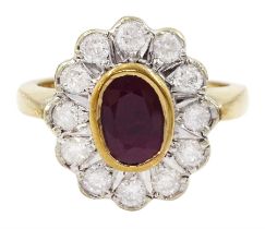 Gold oval cut ruby and round brilliant cut diamond cluster ring
