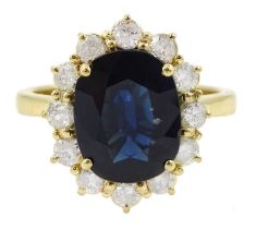 18ct gold oval cut sapphire and round brilliant cut diamond cluster ring