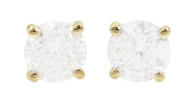 Pair of 18ct gold round brilliant cut diamond stud earrings