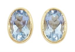 Pair of 9ct gold single stone oval aquamarine stud earrings