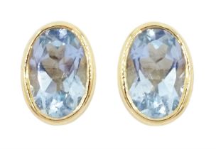 Pair of 9ct gold single stone oval aquamarine stud earrings