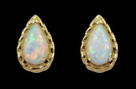 Pair of 9ct gold pear opal stud earrings