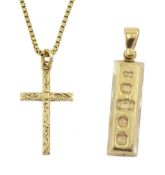 Gold cross pendant necklace and a gold ingot pendant