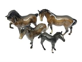 Four Beswick horses