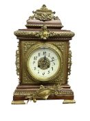 French - Early 20th century 8-day mantle clock in an oak case with pierced brass frets to the sides