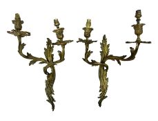 Pair of Rococo style ormolu twin branch wall sconces