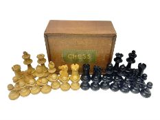 Thirty-two 20th century boxwood and ebonised wooden chess pieces
