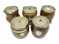 Five early 20th century biscuit barrels with silver-plated mounts