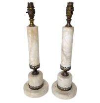 Pair of white stone and brass table lamps