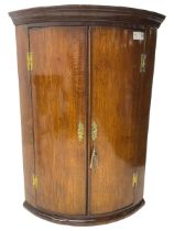 George III oak and mahogany wall hanging cylinder corner cupboard