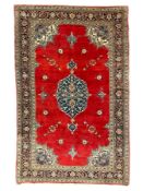 Persian Kashan crimson ground rug