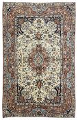 Persian ivory and peach ground rug