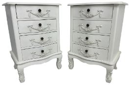 Pair of French design white painted serpentine bedside chests