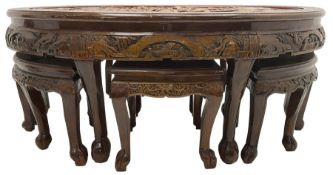 Chinese carved hardwood coffee table with six inset stools or side tables