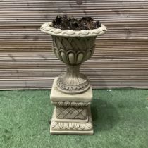 Cast stone urn planter on pedestal base